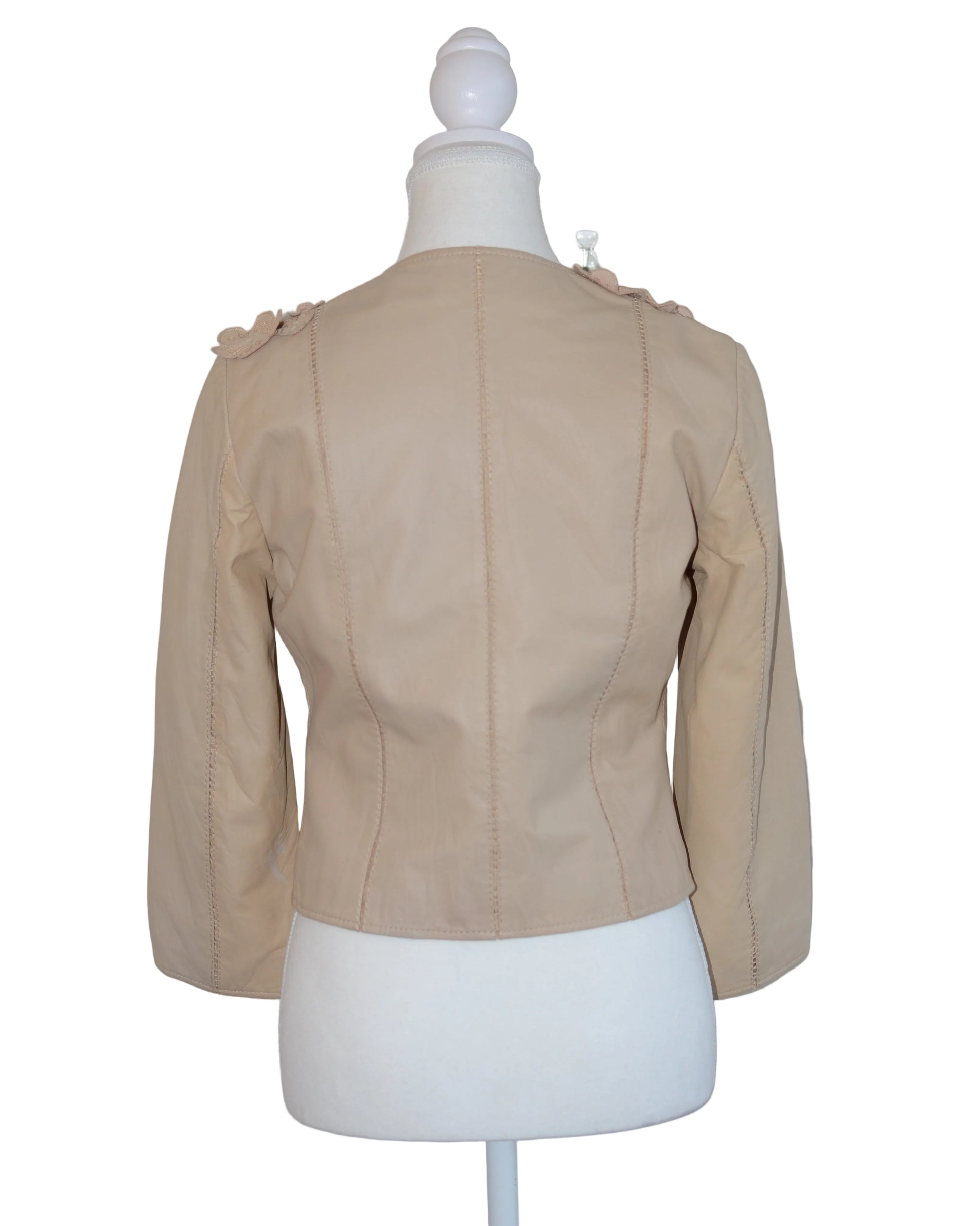 Roberto Cavalli Beige leather jacket with floral embellishments on a mannequin against a white background